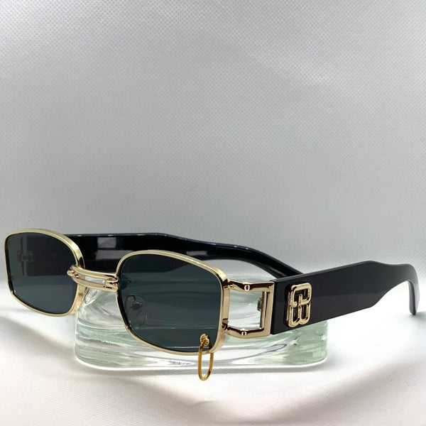 Retro, vintage style sunglasses with black tinted lenses and a gold frame.